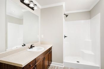 Bathroom with a sink, mirror, and bathtub